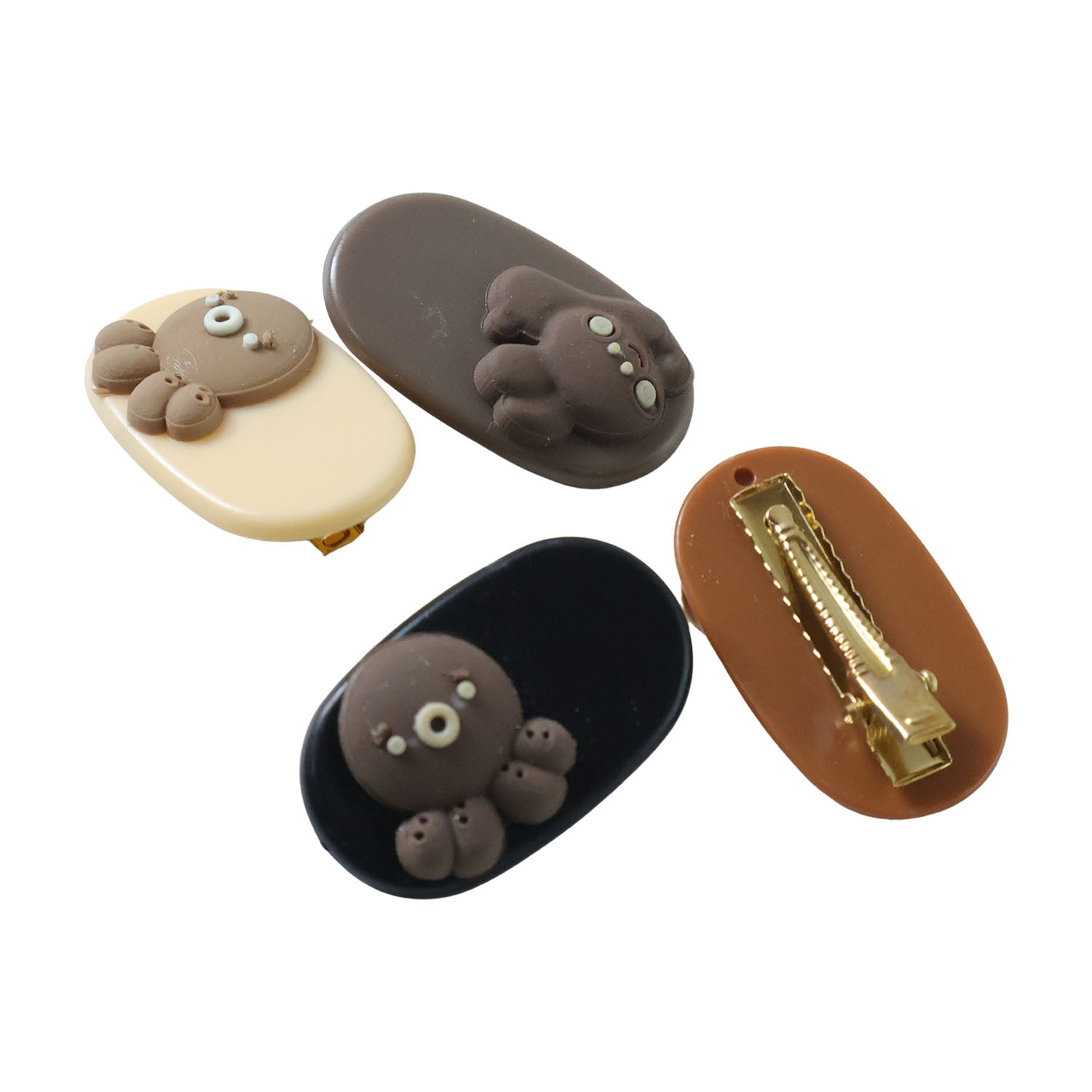 Set of four Wukusy cute cartoon bear design hair clips featuring adorable bear faces on colorful clips.