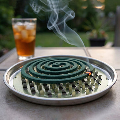 Round metal mosquito coil stand by Wukusy holding a mosquito coil for outdoor insect repellent use.