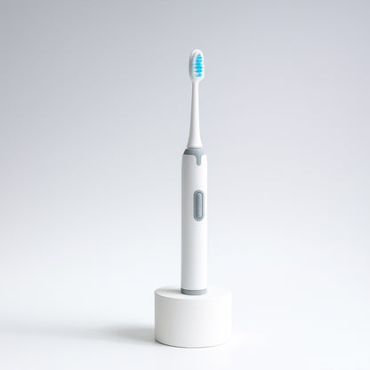 Wukusy electric toothbrush with battery operation, sleek design, and replaceable brush head for effective oral cleaning.