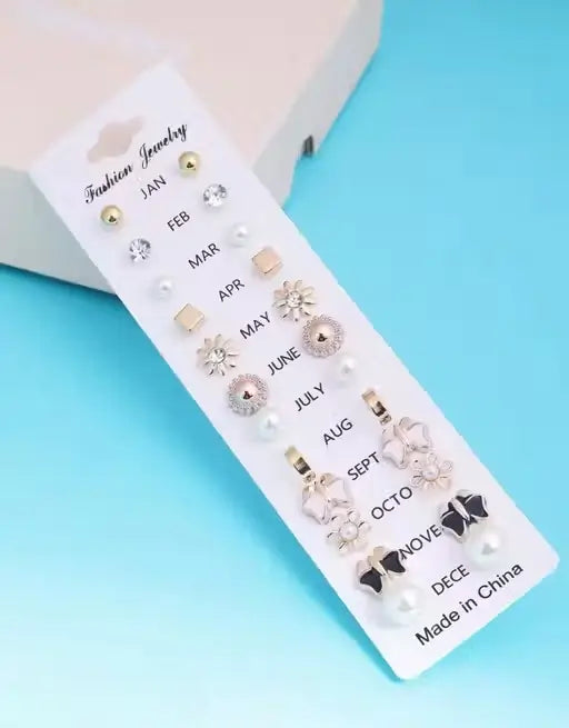 Set of 17 Ekom jewelry stud earrings for girls, featuring metal studs in various designs and sizes.