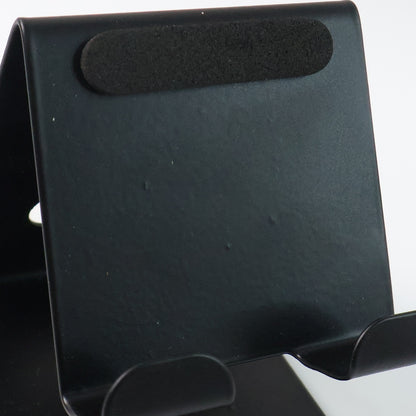 Wukusy metal universal mobile and tablet stand holder, adjustable and sturdy, supporting smartphones and tablets in portrait or landscape mode.