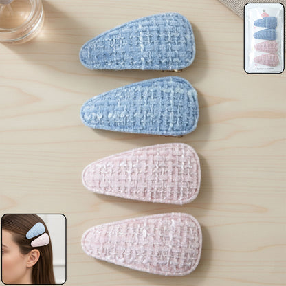 Set of four Wukusy textured fabric snap hair clips showing colorful, patterned designs on a white background.