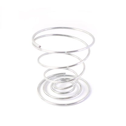 Stainless steel spring egg cup holder by Wukusy, designed to securely hold a boiled egg in a kitchen setting.