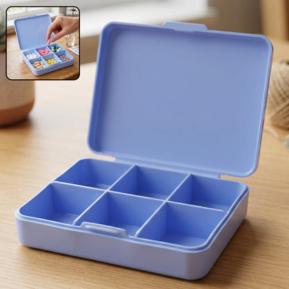 Wukusy 6-compartment plastic pill organizer box for portable medicine storage with labeled sections for daily pills.