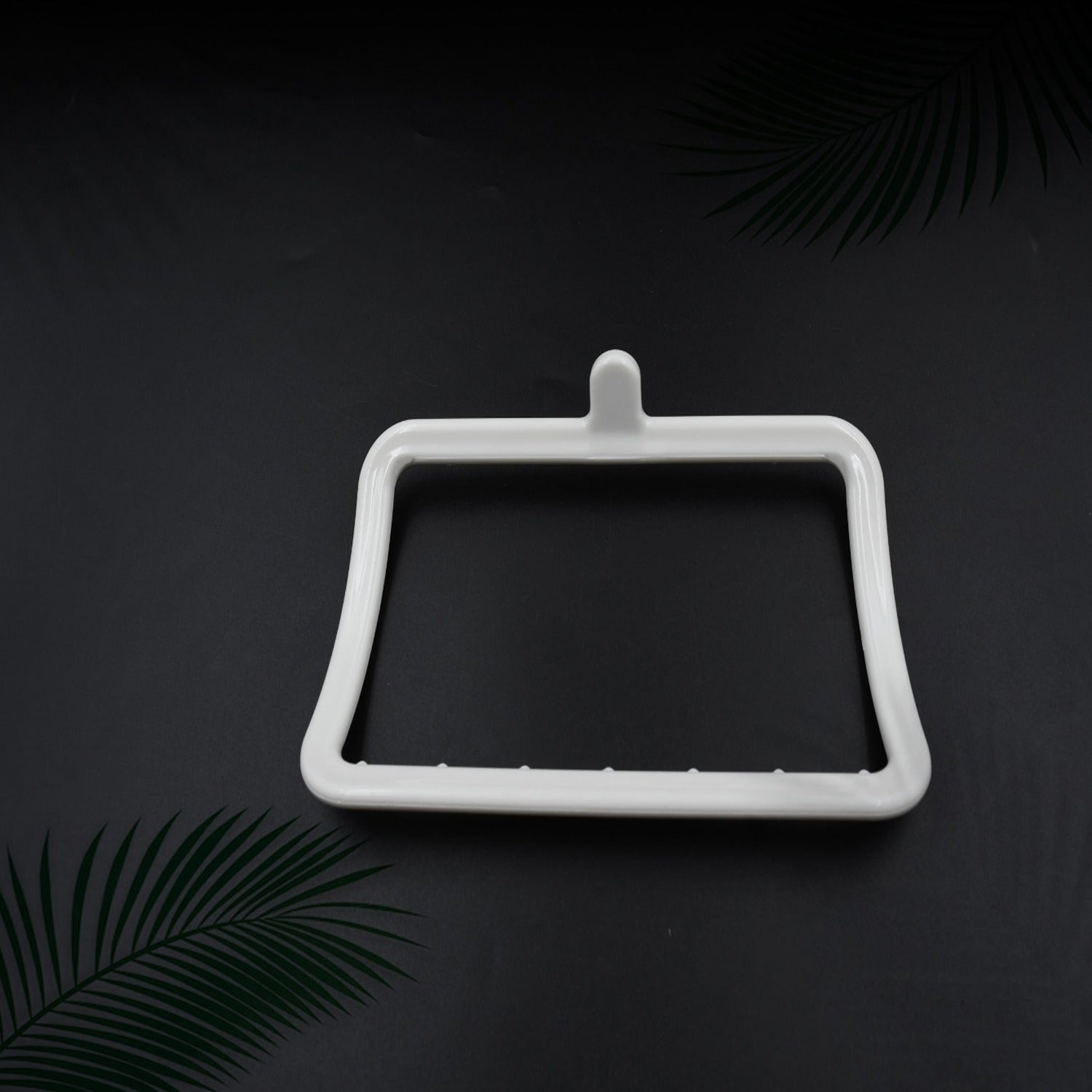 Wukusy 4096 multi-purpose self-adhesive wall-mounted hand towel holder on a bathroom wall, showing strong adhesive backing.