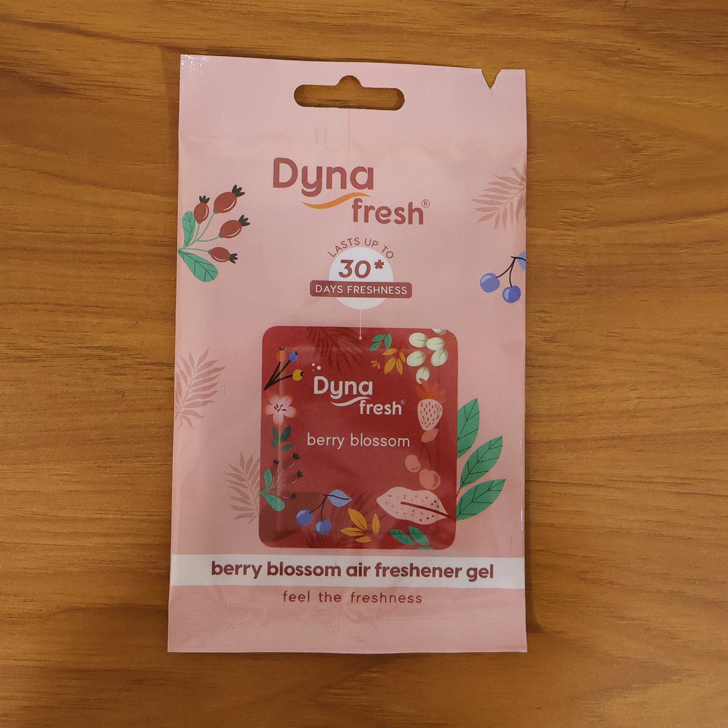 Wukusy hanging bathroom air freshener gel with berry blossom scent, 10g jar showing floral design and gel inside.