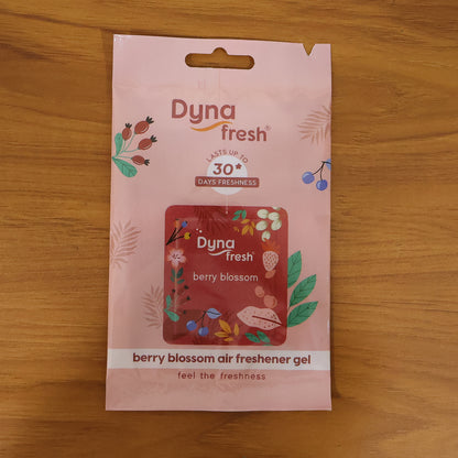 Wukusy hanging bathroom air freshener gel with berry blossom scent, 10g jar showing floral design and gel inside.