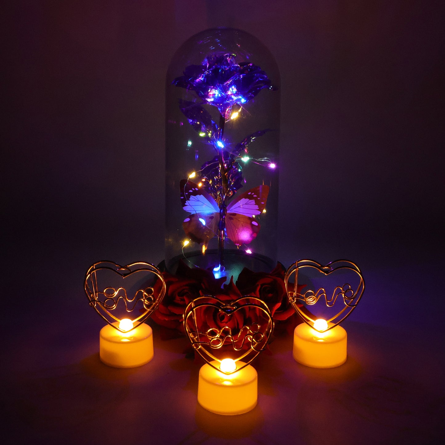 Romantic gift set from Wukusy featuring a candle, chocolates, and a small bouquet, perfect for special occasions.