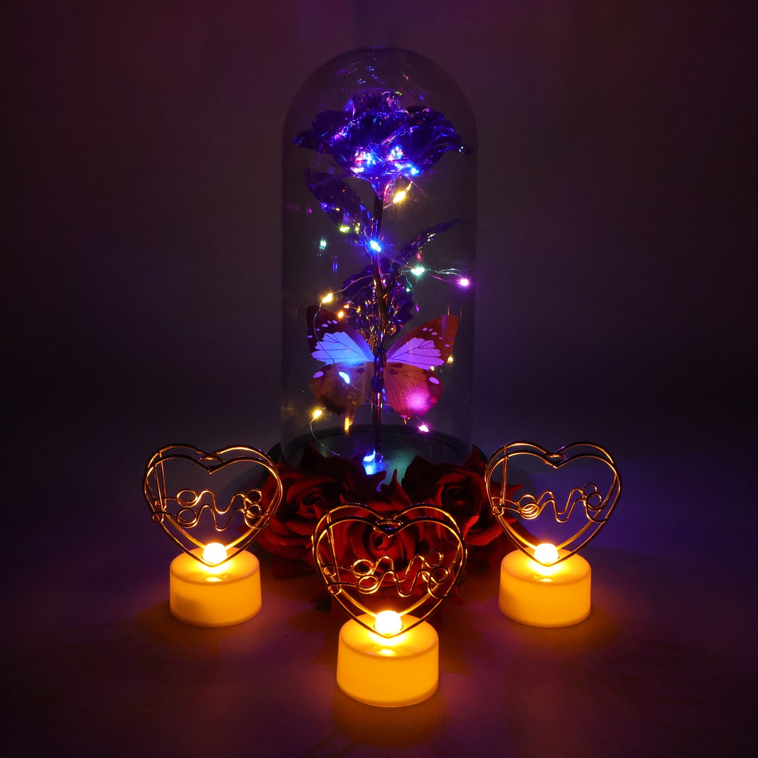 Romantic gift set from Wukusy featuring a candle, chocolates, and a small bouquet, perfect for special occasions.