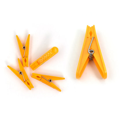 Wukusy 6136 12-piece cloth clip set for household and office use, holding clothes and various items efficiently.