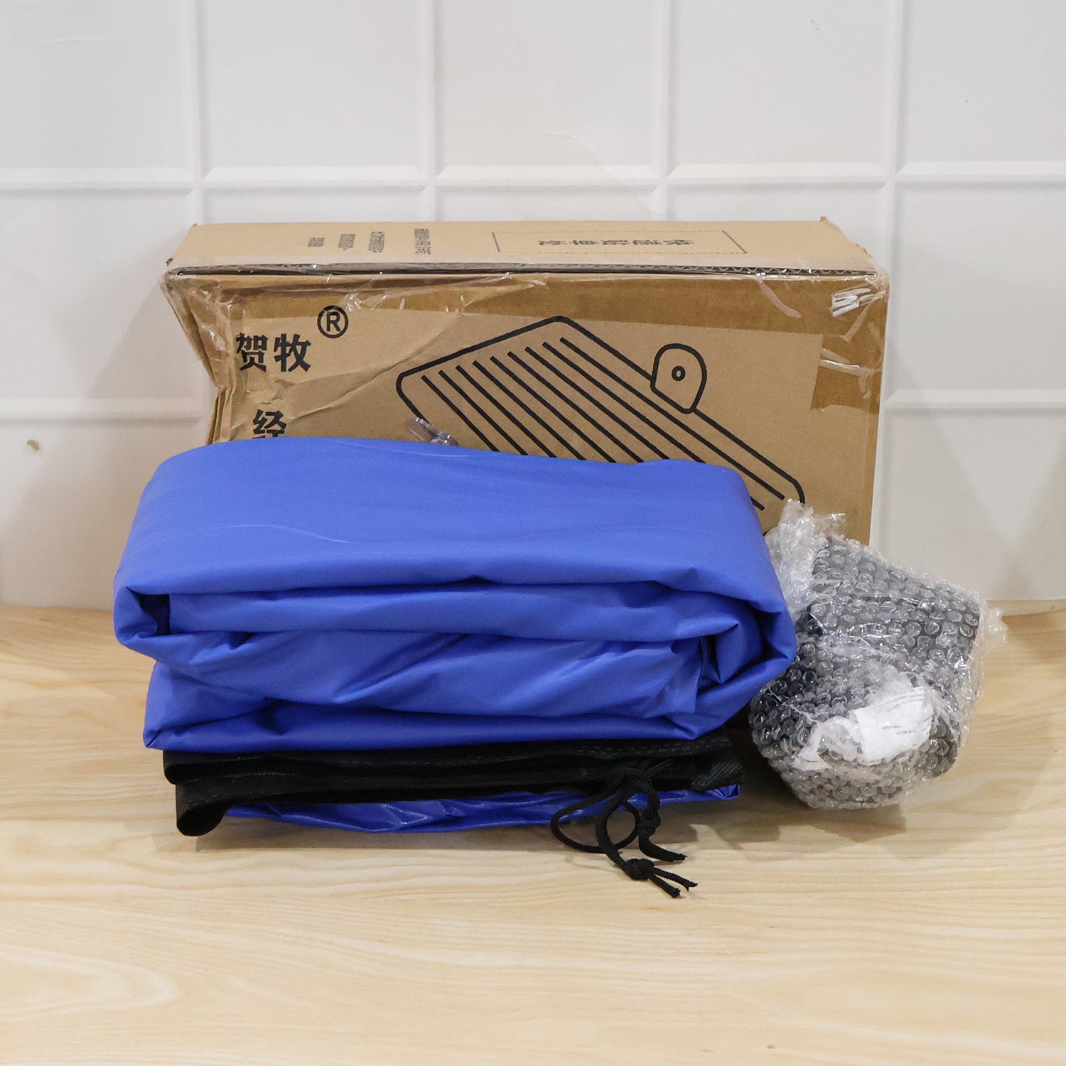 Dark blue Wukusy portable car air mattress bed set with pump and pillows, fully inflated and ready for use inside a vehicle.