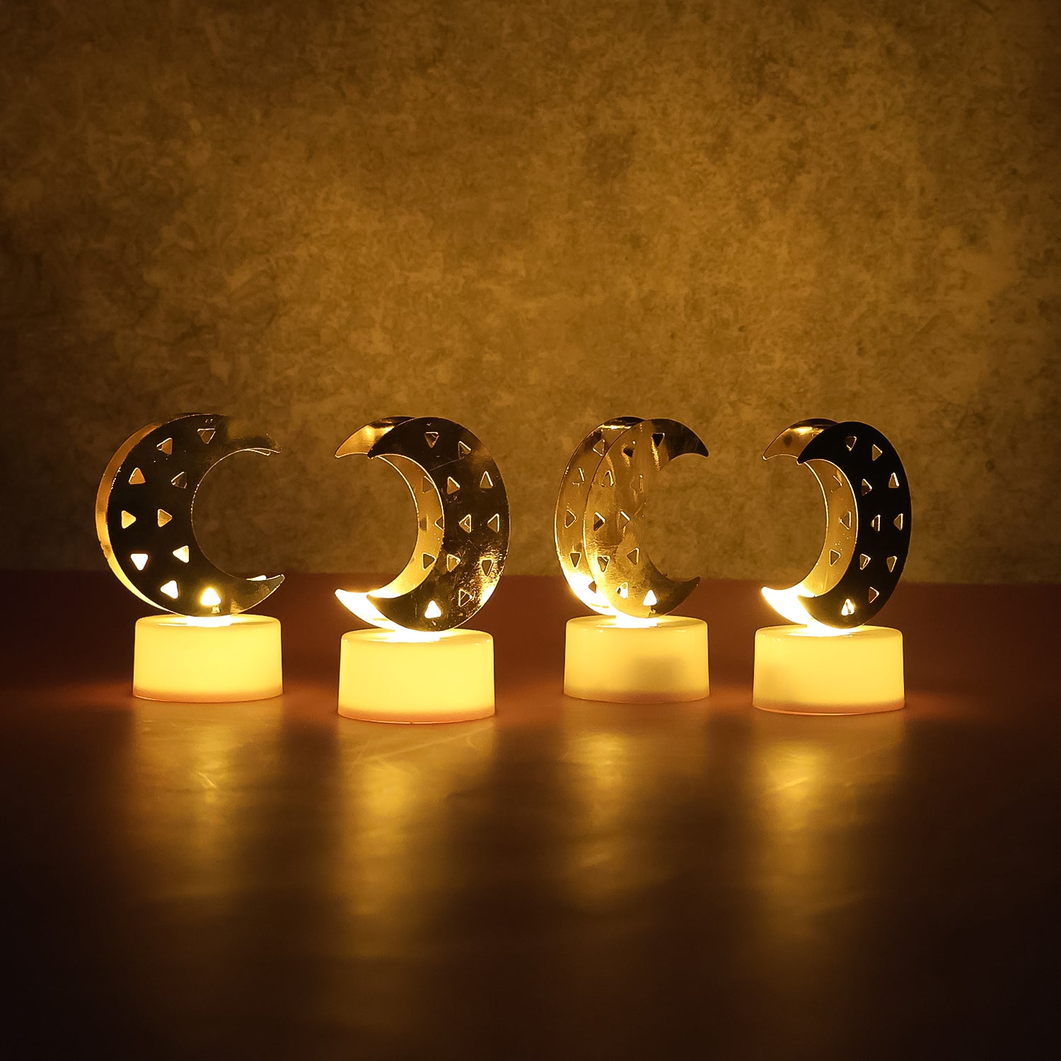 Set of four Wukusy decorative moon-shaped flameless LED candles for home decor, with soft glowing moon designs.