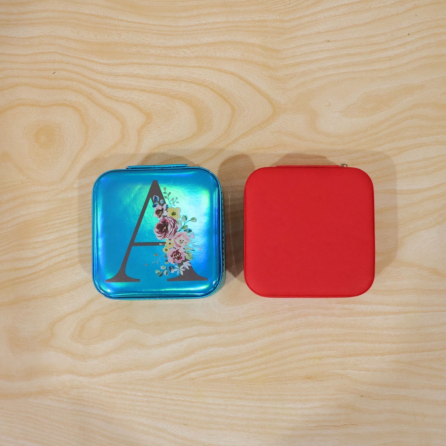 Wukusy mini jewelry organizer box with mirror, featuring compartments for rings and earrings, shown open with jewelry inside.