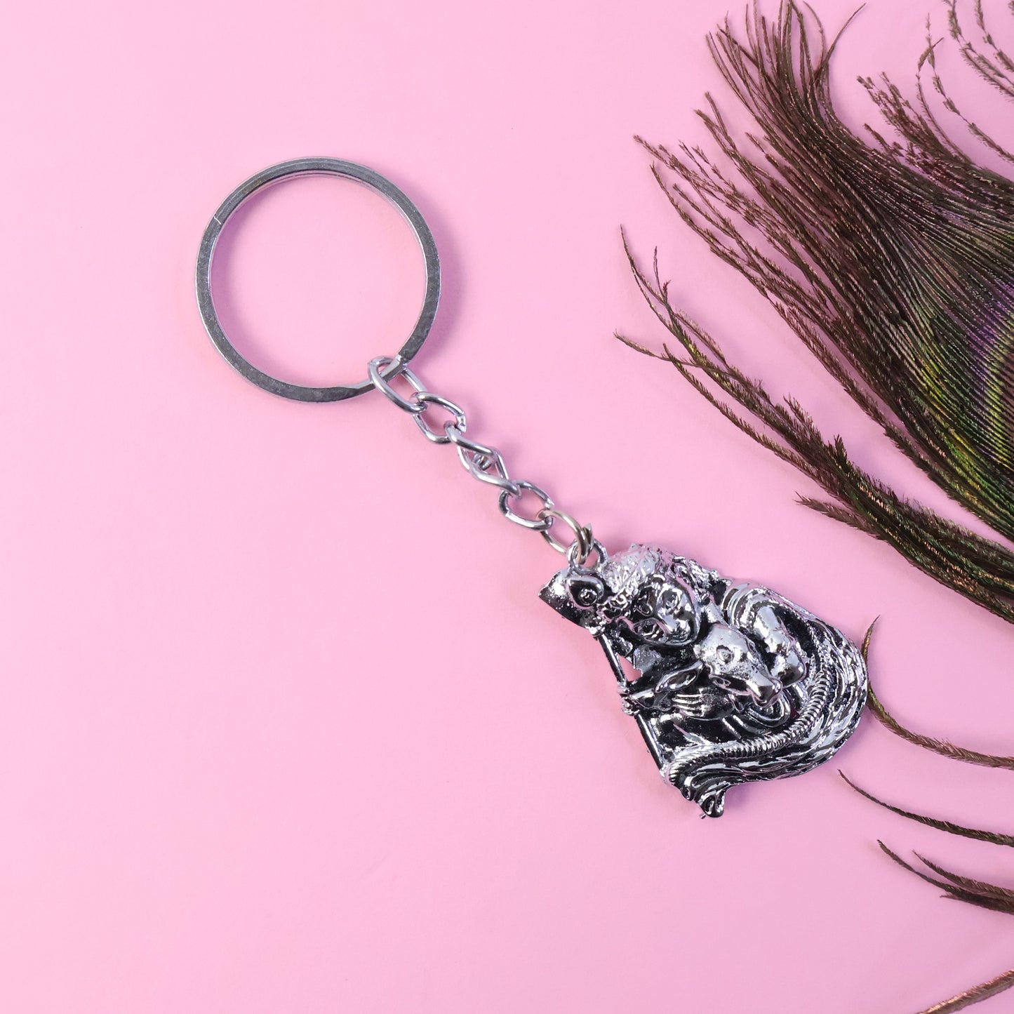 Silver-finish metal keychain from Wukusy with a sleek, polished design, displayed on a neutral background.