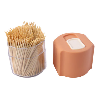 Wukusy toothpick dispenser box set with automatic pop-up holder on a dining table, compact and convenient for kitchen use.