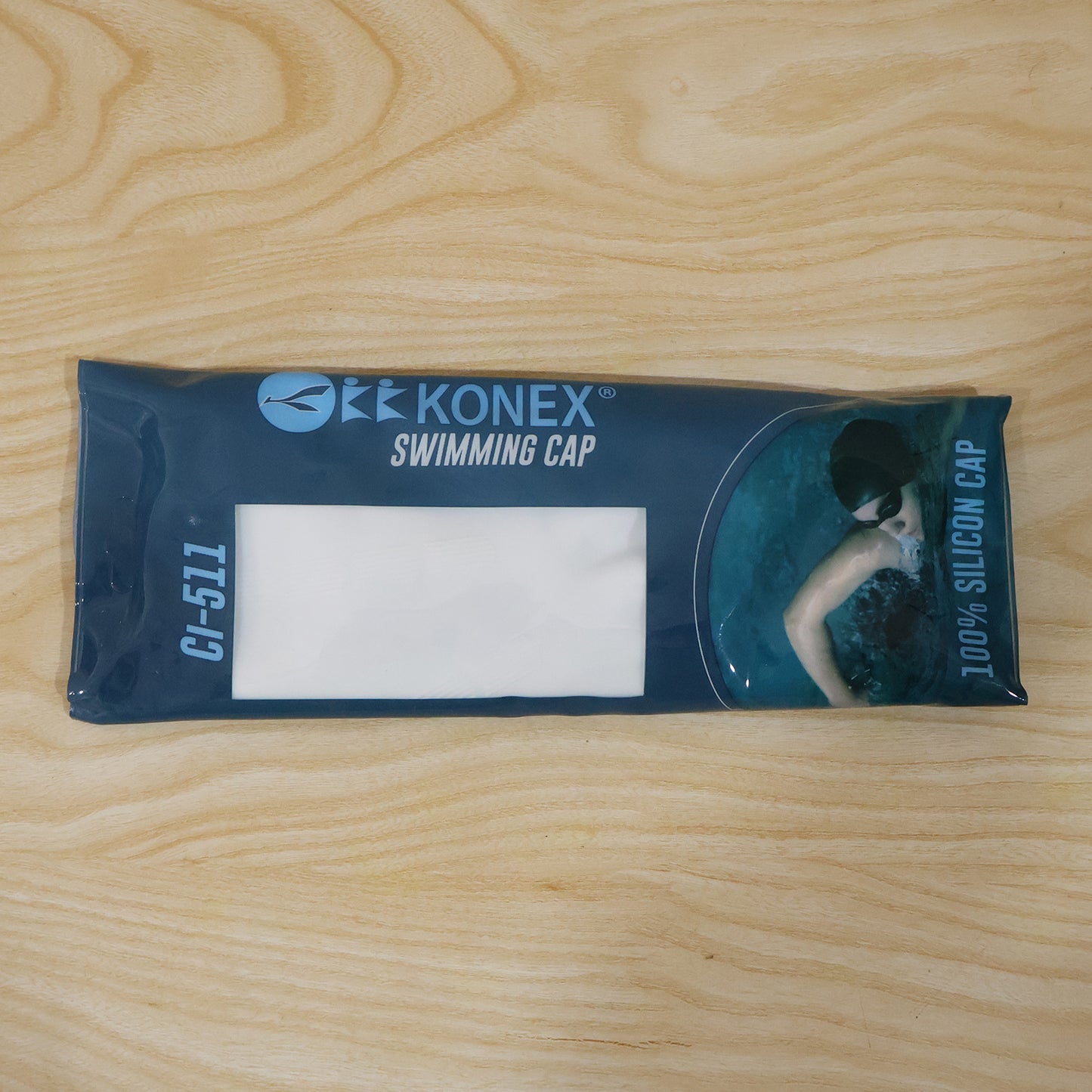Wukusy Konex flexible silicone waterproof swimming cap for adults and kids, shown in vibrant blue, fits snugly over head for water protection.