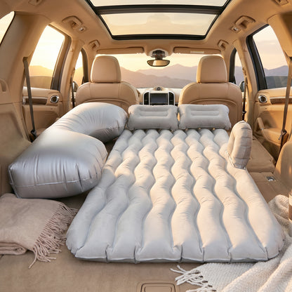 Grey Wukusy portable car air mattress set with pump and pillows, fully inflated for comfortable sleeping in the car.