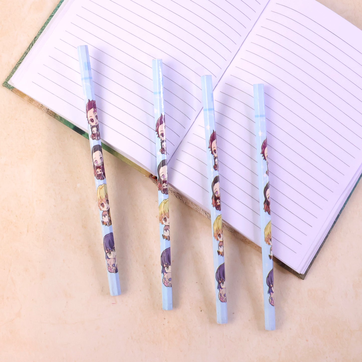 Four colorful cartoon printed pencils for kids from Wukusy, cute school writing tools with fun designs and bright colors.