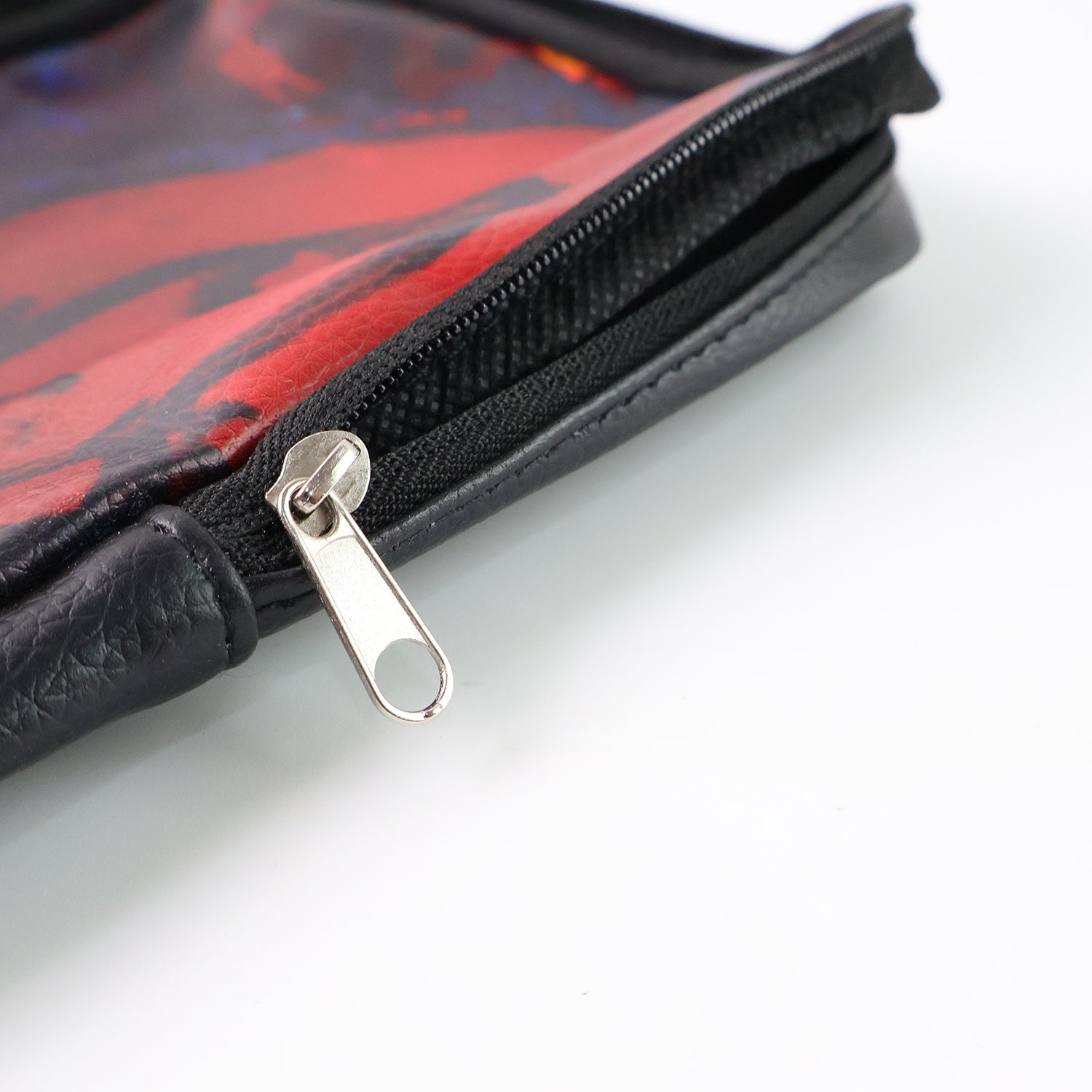 Handcrafted Wukusy multipurpose zipper pouch with traditional art print, ideal for office organization, shown with zipper closed.