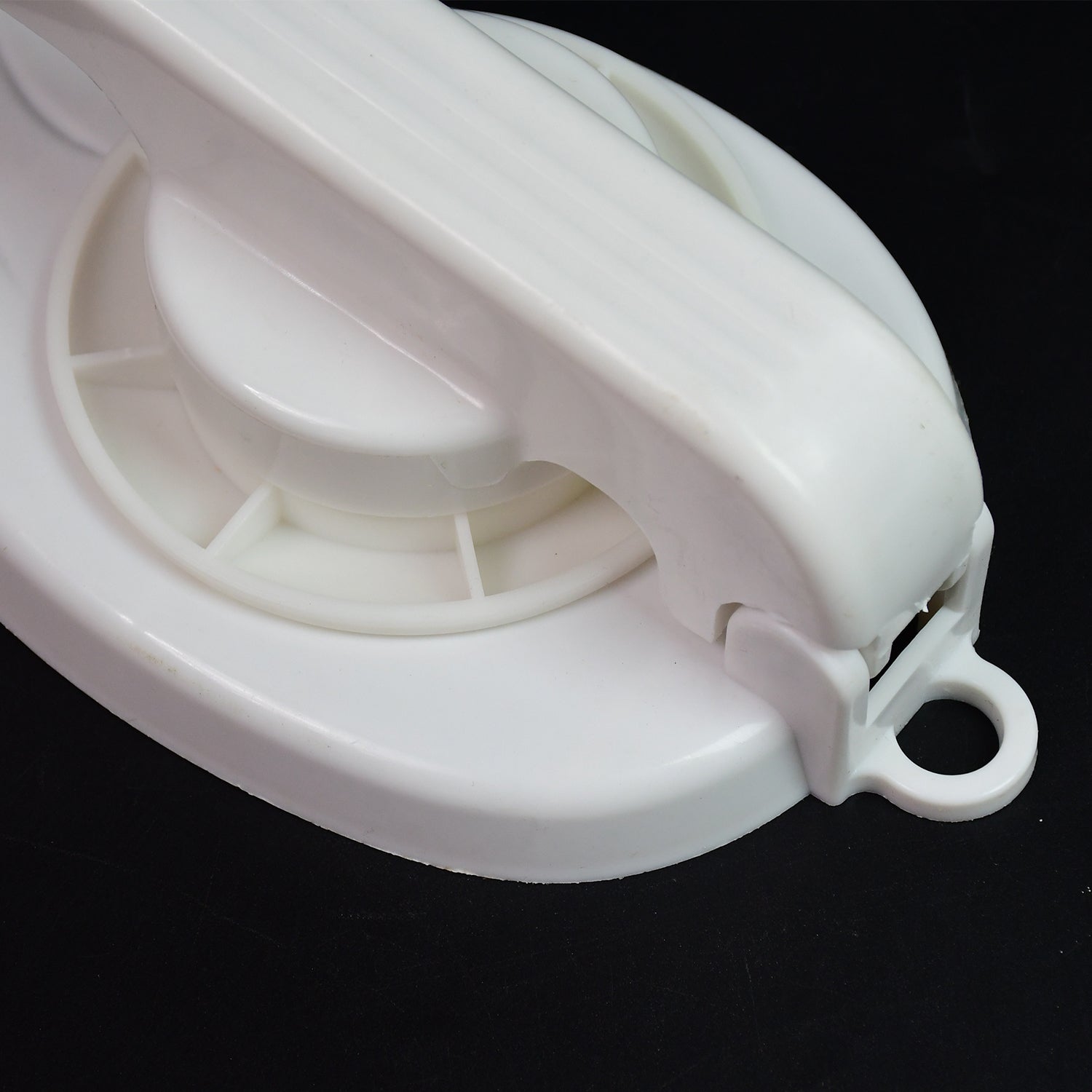 Wukusy 7192 Puri Chapati Press Machine made of plastic, kitchen tool for making chapatis, shown on a clean kitchen surface.