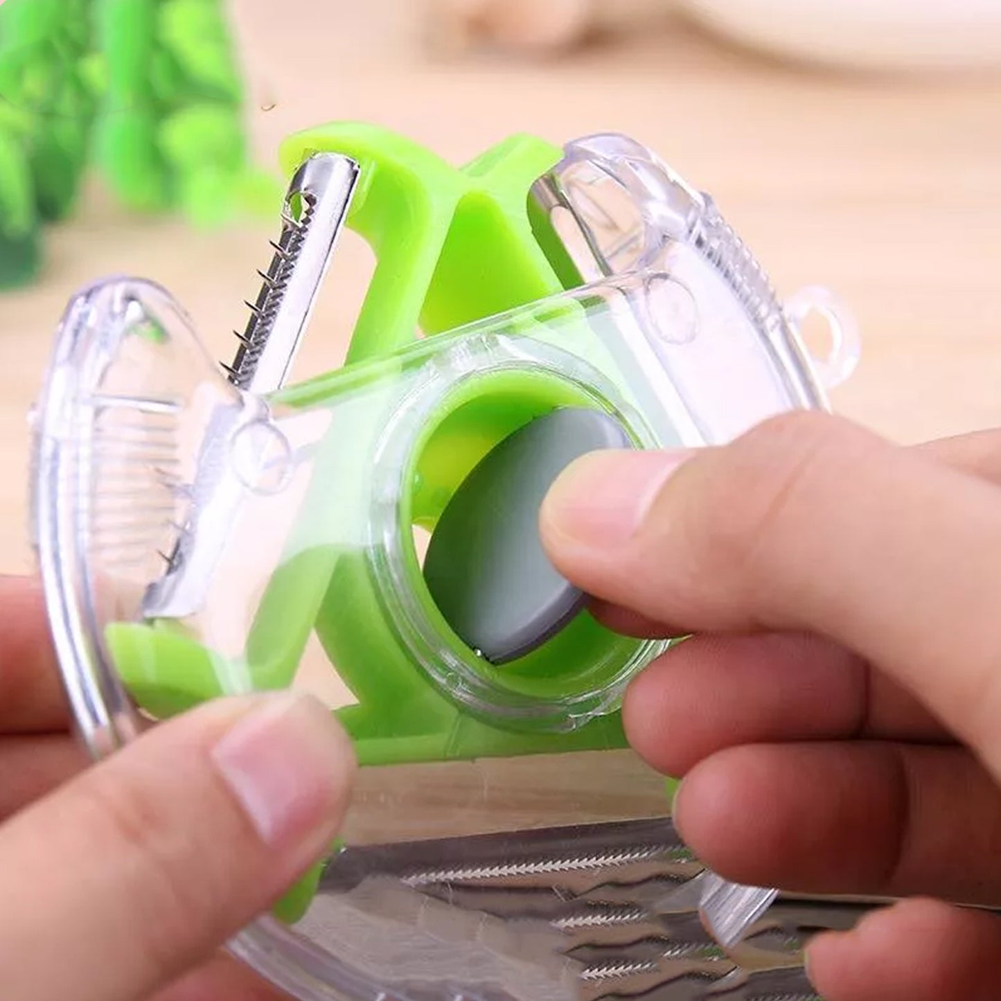 Wukusy 2774 round planer peeler and vegetable slicer with stainless steel blade for peeling and cutting in the kitchen.