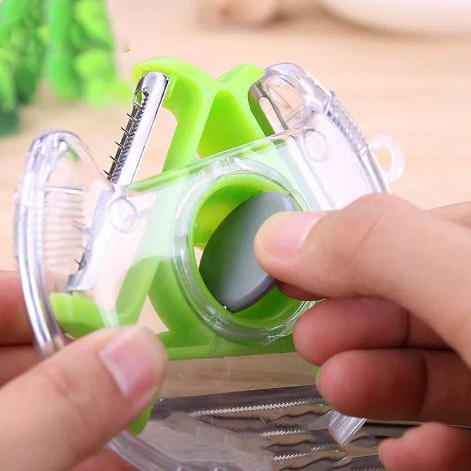 Wukusy 2774 round planer peeler and vegetable slicer with stainless steel blade for peeling and cutting in the kitchen.