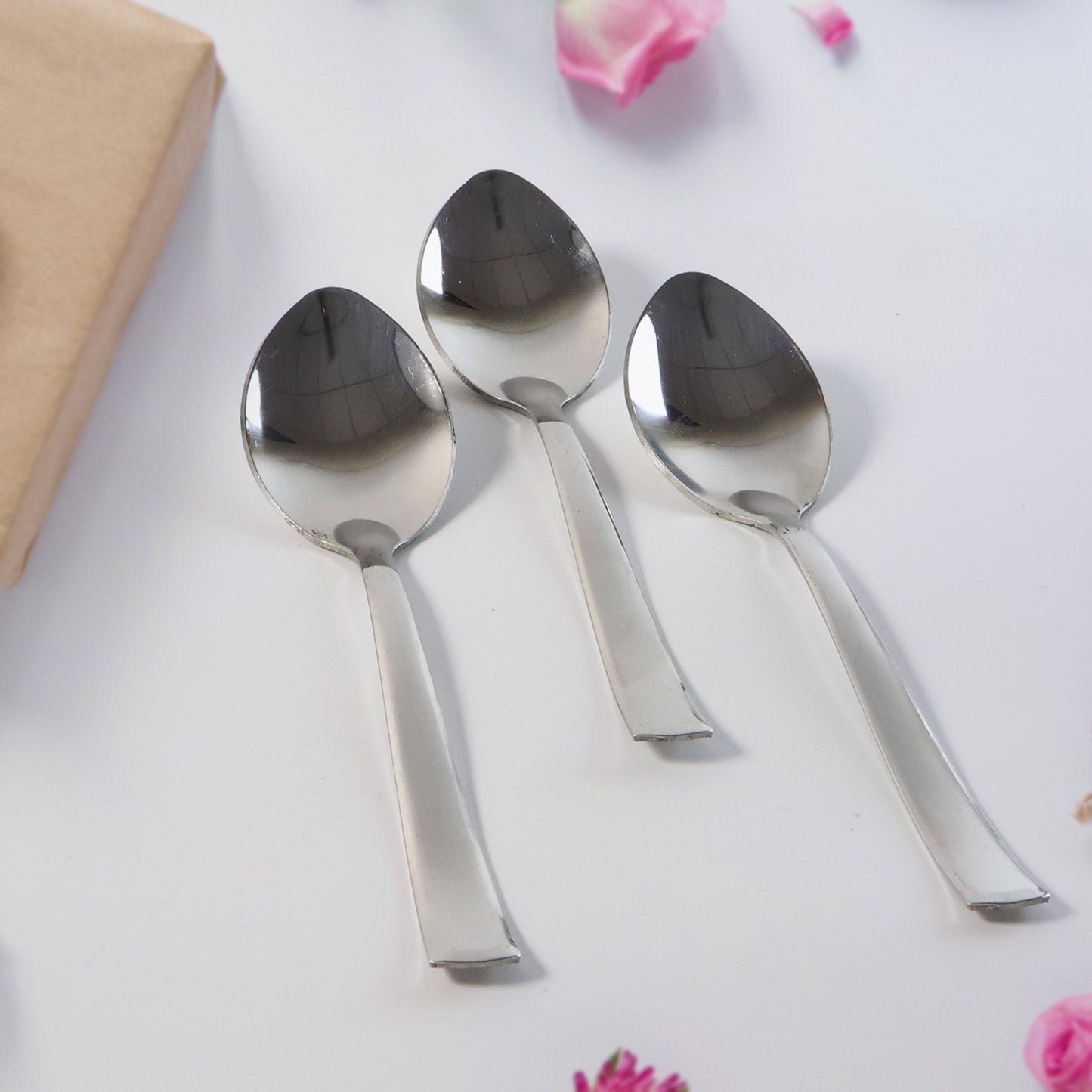 Set of three Wukusy everyday dining spoons, stainless steel utensils for home dining, arranged on a clean kitchen surface.