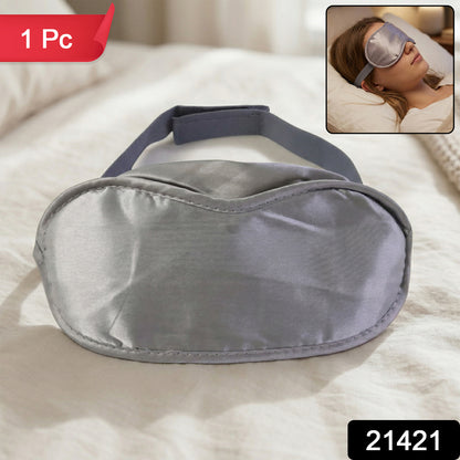 Soft Wukusy sleep eye mask lying flat, made of comfortable fabric, designed to block light for restful sleep.