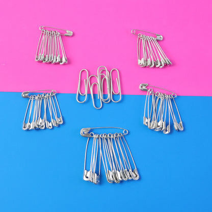Set of assorted metal safety pins in various sizes, displayed on a white background, from Wukusy's multipurpose safety pin collection.