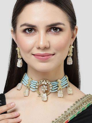White designer Kundan choker necklace set with light blue crystal beads and tumbler design, ideal for elegant traditional occasions.