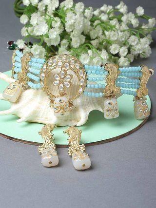 White designer Tumble light blue crystal beaded Kundan choker necklace set with intricate craftsmanship and traditional design.