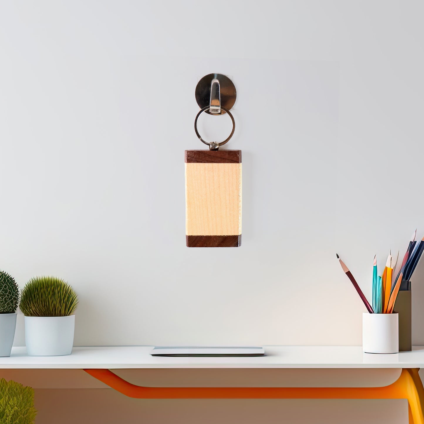 Wooden keychain with dual-tone finish from Wukusy, featuring smooth polished surface and compact design for everyday use.