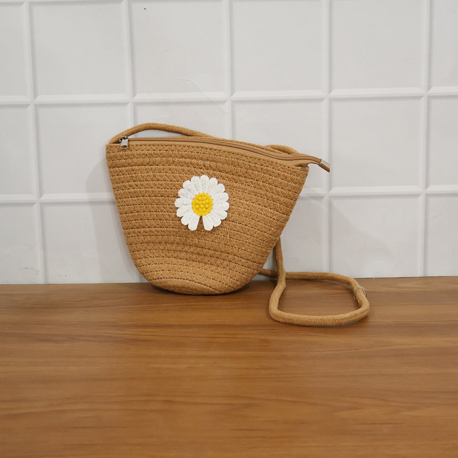Wukusy stylish jute crossbody sling bag with adjustable strap, 17x23 cm, featuring natural woven texture and compact design.