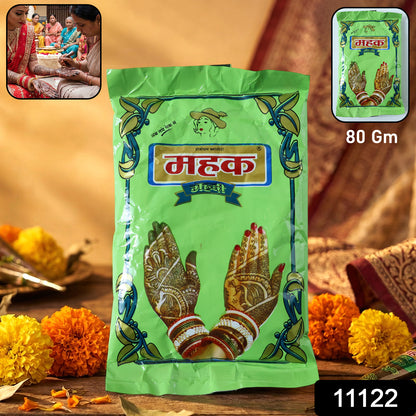 Traditional herbal Mehndi powder in an 80 gram pack by Wukusy, showing vibrant green henna powder in a natural setting.