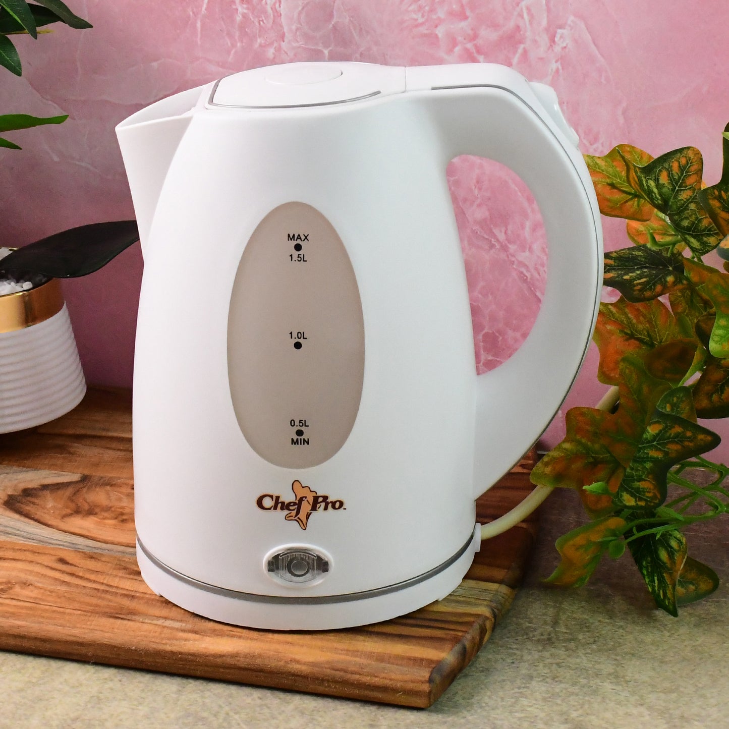 Wukusy Orbit electric kettle with 1.5-liter capacity, sleek stainless steel design on a kitchen countertop.