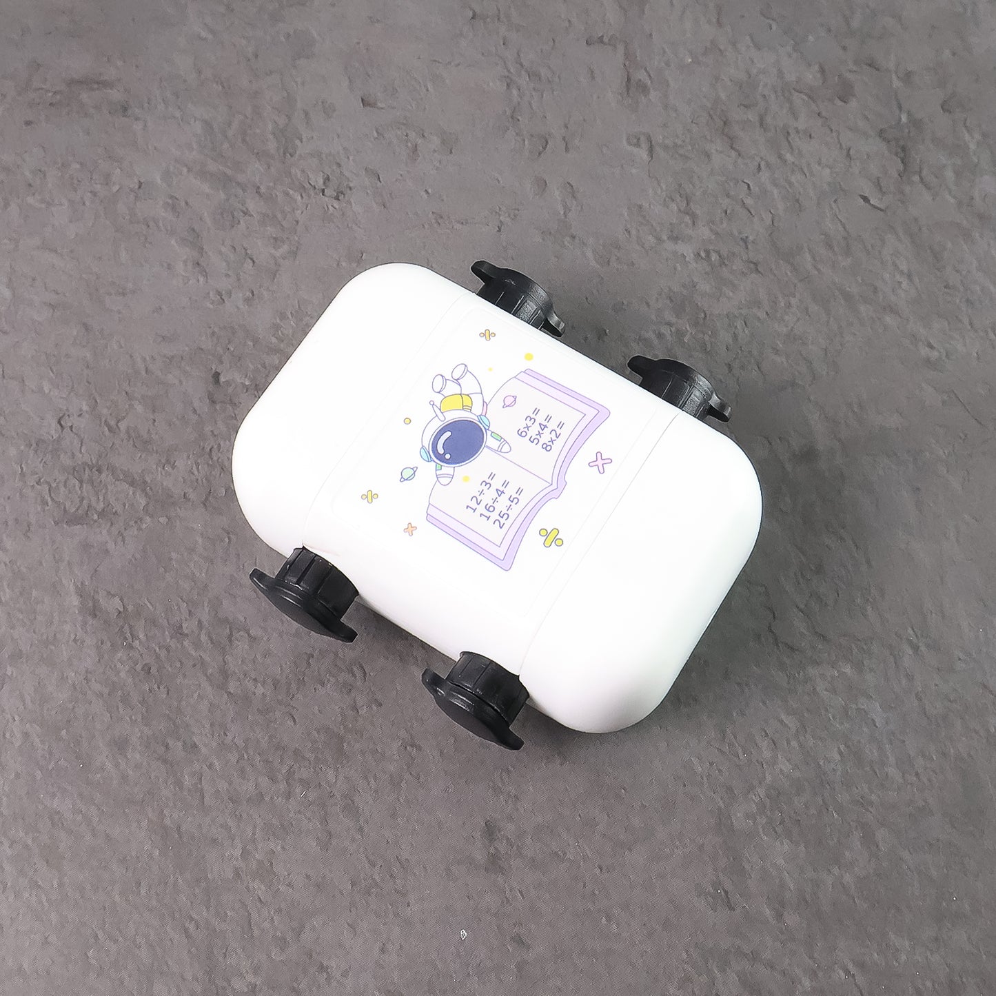 Kids educational Wukusy automatic math problem rolling stamp showing colorful numbers and math symbols on a white background.