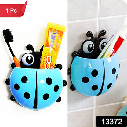 Wukusy ladybug toothbrush holder in bright red with black spots, designed for bathroom organization and toothbrush storage.