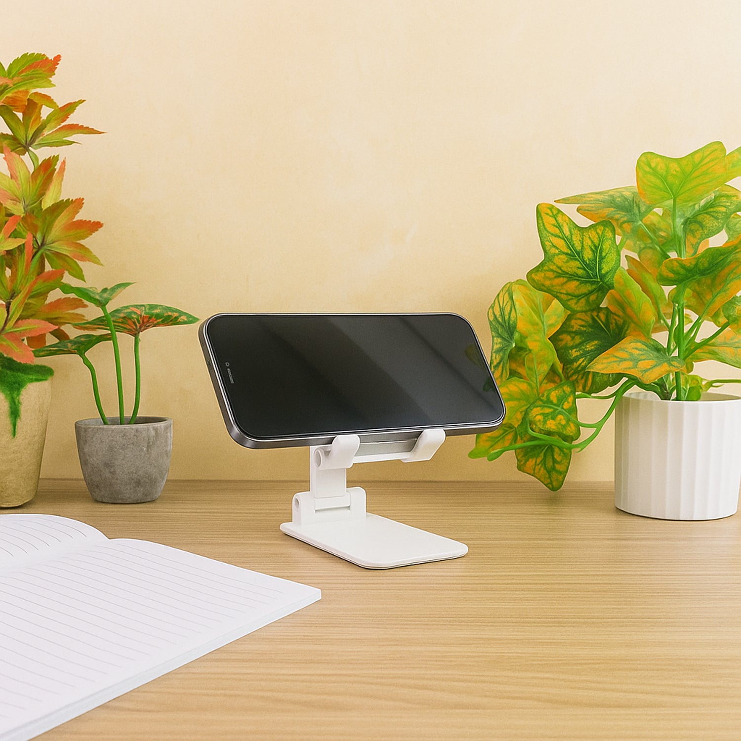 Wukusy adjustable foldable desktop mobile stand holding a smartphone, designed for hands-free viewing and easy portability.