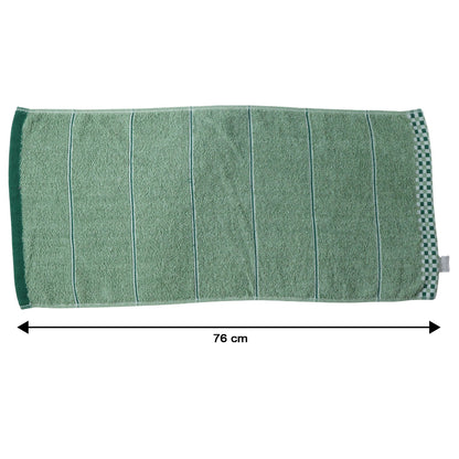 Soft cotton bath towel by Wukusy, 76x34 cm, showcasing plush texture and absorbent material in a neutral color.