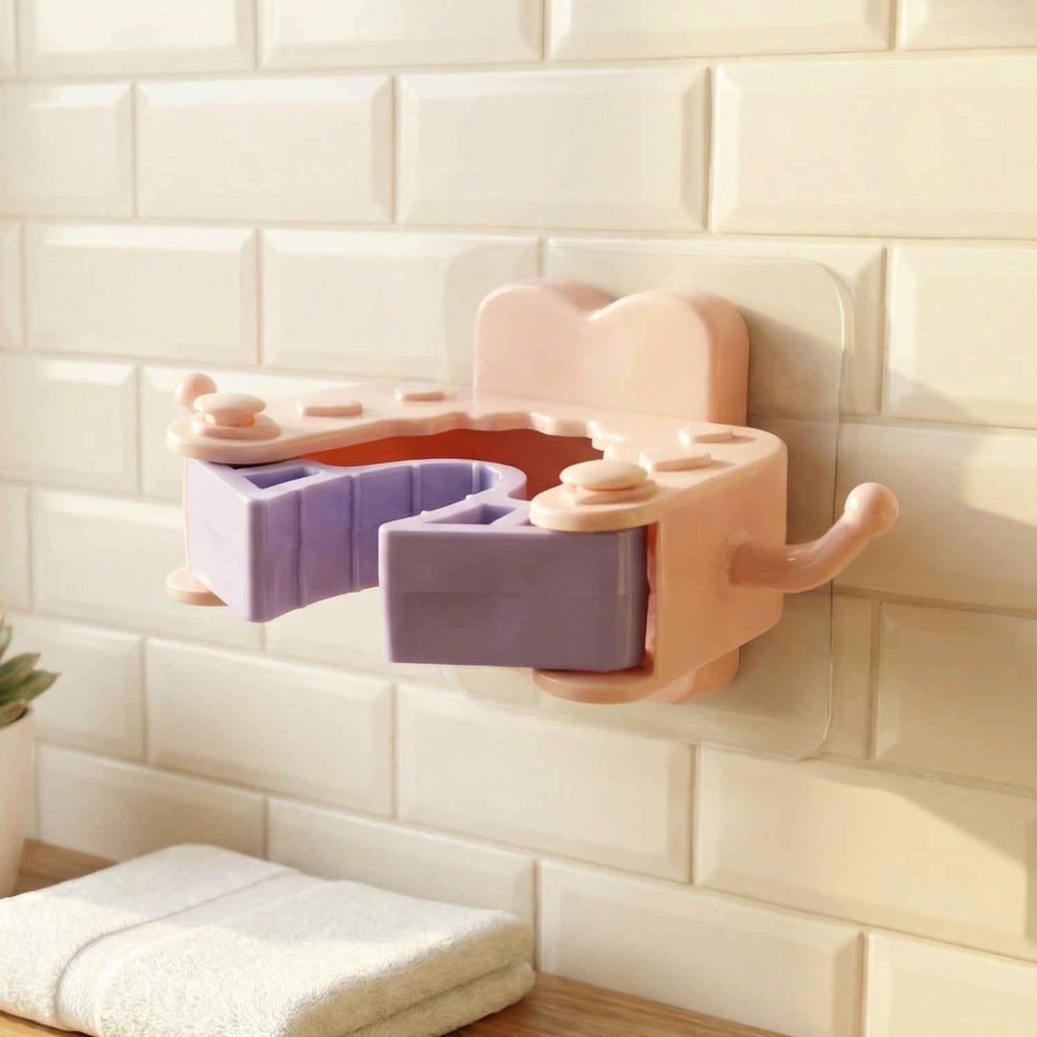 Wall-mounted broom and mop holder clips set by Wukusy, showing four durable plastic clips for organizing cleaning tools.