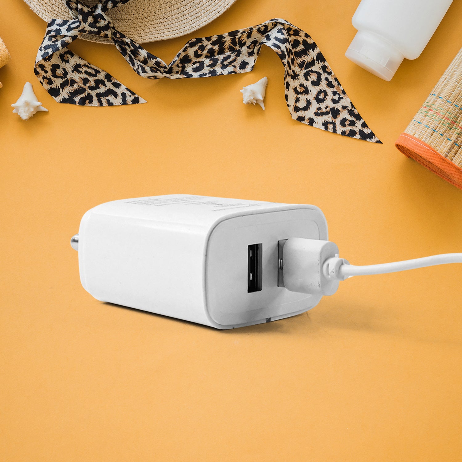Wukusy Iball dual USB wall charger with 5V 3.1A fast charging ports for mobile devices, shown connected to a smartphone.