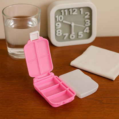 Portable pink dual-sided pill organizer box by Wukusy, compact travel-friendly health and beauty storage for pills and supplements.