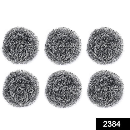 Pack of six Wukusy stainless steel round scrubbers, durable kitchen cleaning tools with metal mesh for scrubbing dishes.