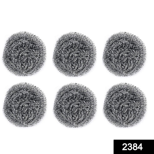 Pack of six Wukusy stainless steel round scrubbers, durable kitchen cleaning tools with metal mesh for scrubbing dishes.