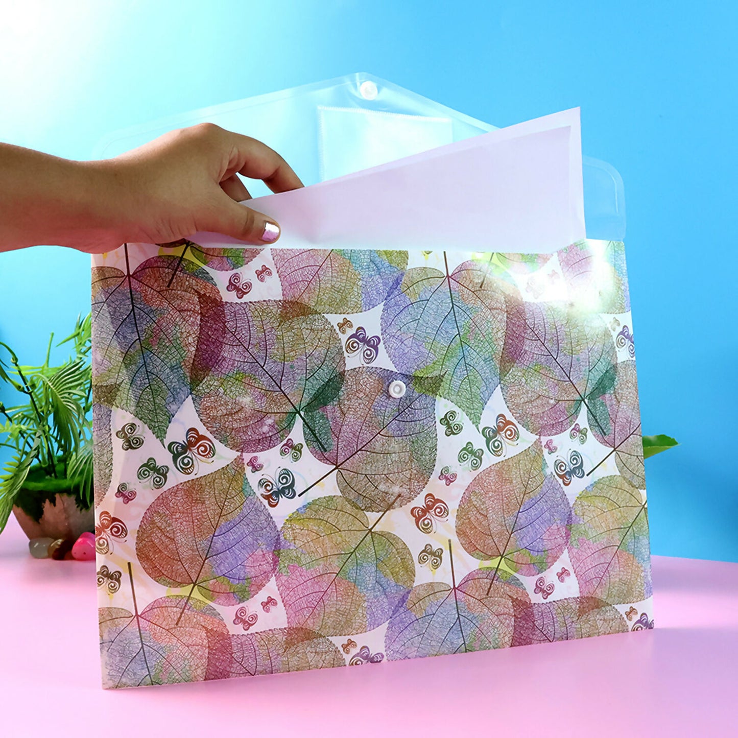 Wukusy printed A4 document folder with leaf design, button closure, and label slot, shown with the folder open and closed.