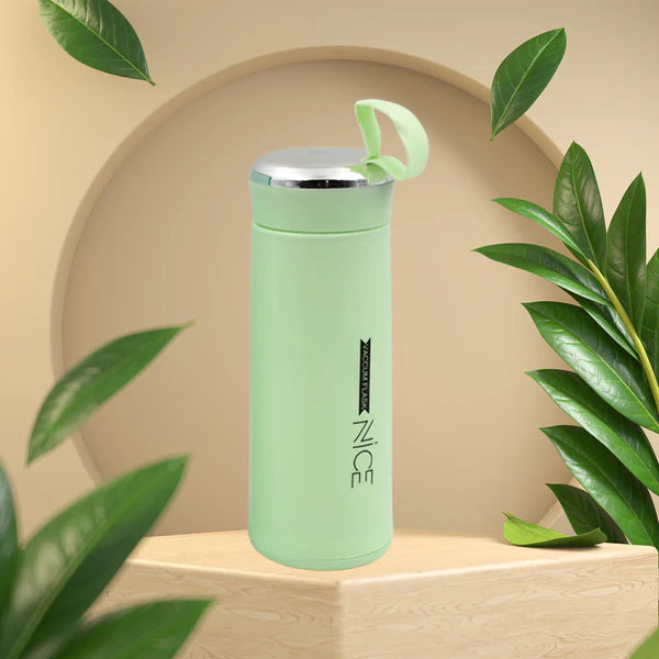 Light green 400ml Wukusy leak-proof glass water bottle for gym and children, featuring a secure lid and daily water intake markings.
