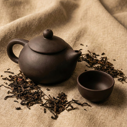 Black clay ceramic tea set with teapot and four cups by Wukusy, ideal for home & kitchen tea service.