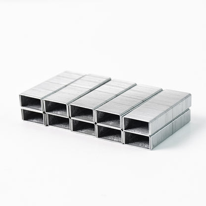 Wukusy Kangaro 246-1m high-quality steel staples for office use, durable steel pins stacked neatly in an office setting.