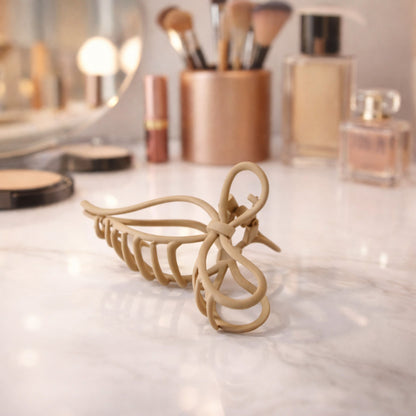 Wukusy minimalist matte finish elegant hair claw clip for women, showcasing its sleek design and secure grip.