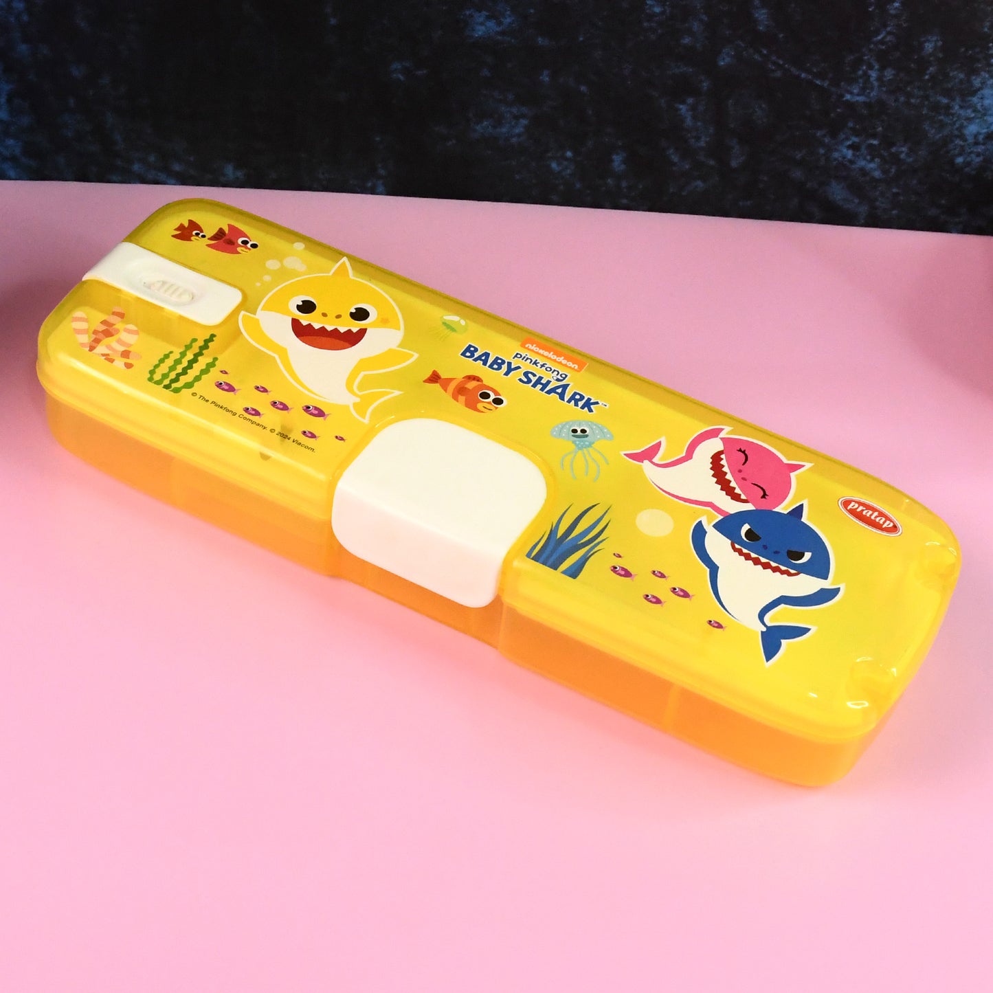 Plastic pencil box with LED light featuring cartoon print, ideal for office use by Wukusy, shown with colorful design and compartments.